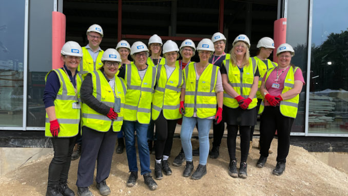 Theatre team on the building site wearing hard hats (002)