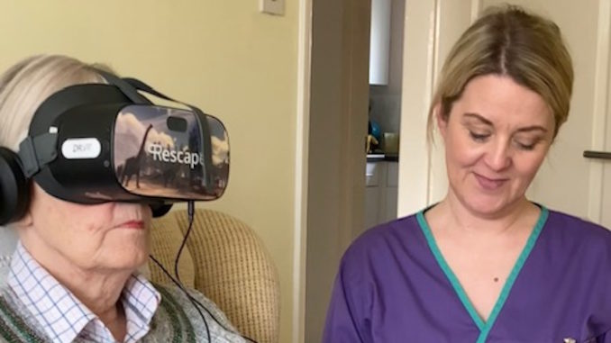 Kimberley Almond with Lynda as she tries the new VR headset (002)